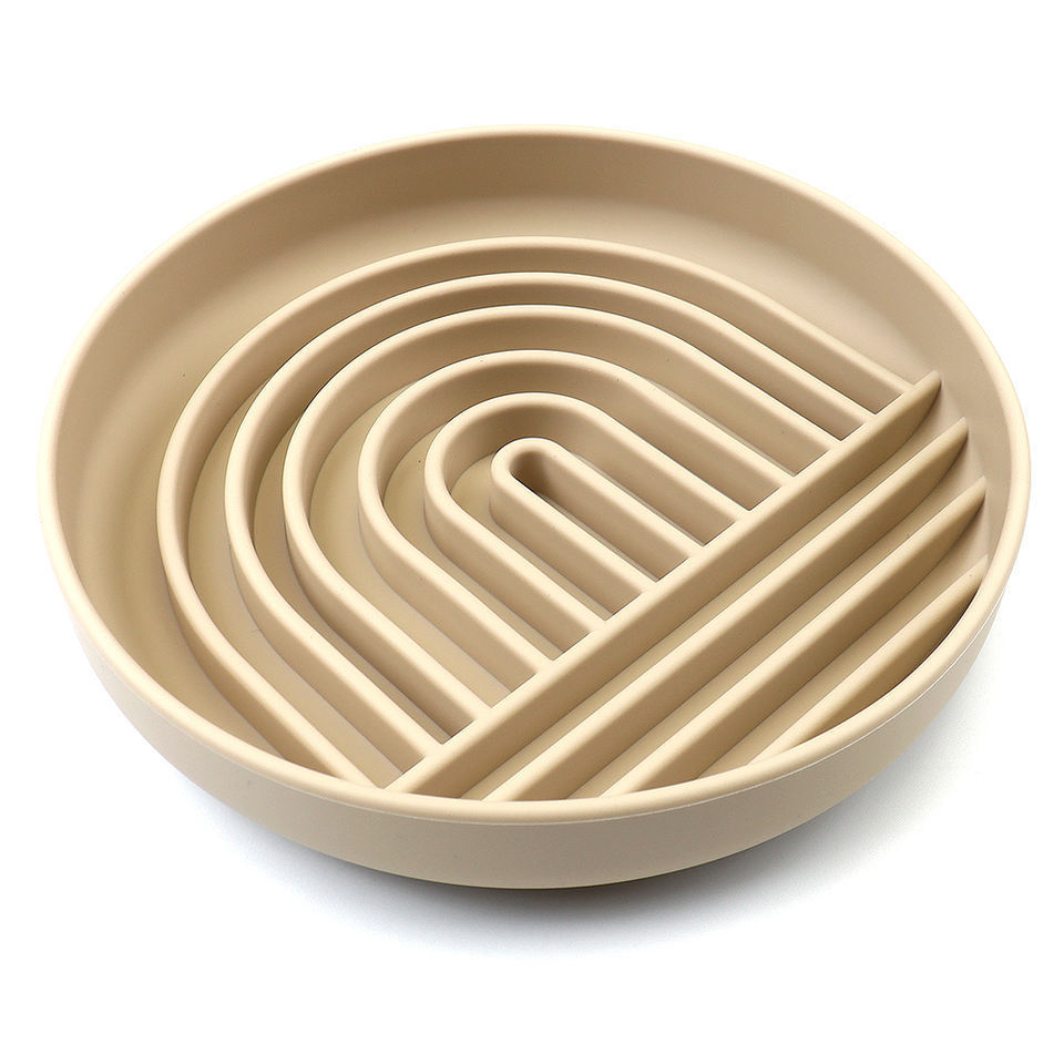 Beige puzzle feeder with wavy design on a white background
